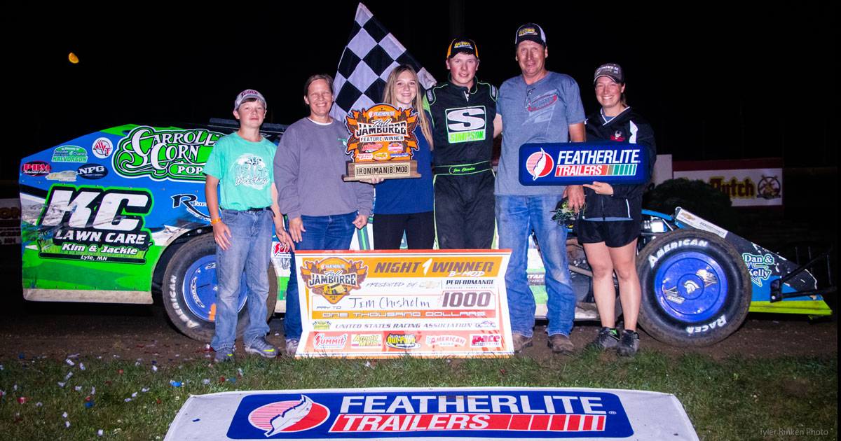 Jim Chisholm celebrates with family and crew members after winning the Out-Pace USRA B-Mod main event.