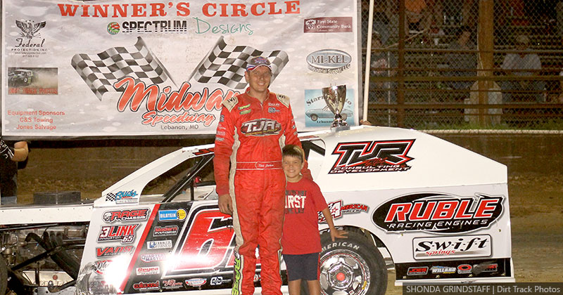 Kris Jackson is joined by his son, Carter, after winning the USRA B-Mod main event at the Lebanon Midway Speedway in Lebanon, Mo., on Friday, July 17, 2020.