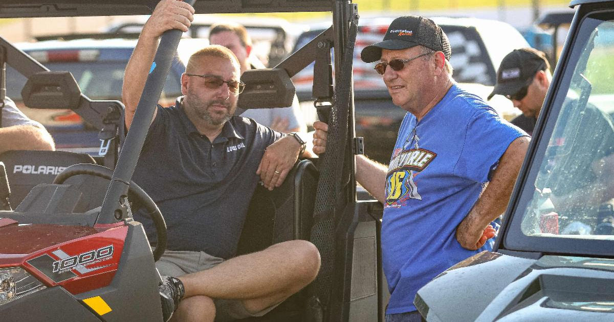 Dan Robinson (left), talking with Ken Schrader at a past Lucas Oil Speedway event, has been promoted to Lucas Oil Vice President of Motorsports Operations. (GS Stanek Racing Photography)