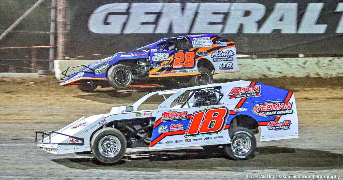 Eventual winner J.C. Morton (18) battles for the lead with Andy Bryant (28) on the final lap of the second of two USRA B-Mod main events.