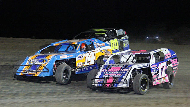 Jim Moody (00) works the high side of Kameron Grindstaff (14) and Jake Richards (17) Friday night at the Central Missouri Speedway. Moody went on to win the Out-Pace USRA B-Mod feature. (Joshua Allee Photo)