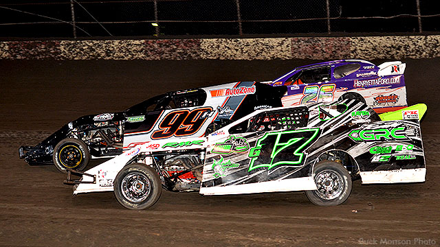 Trevor Hunt (99) inches ahead of Fito Gallardo (17) and Brian Williams (26) at the start of the USRA Modified feature.