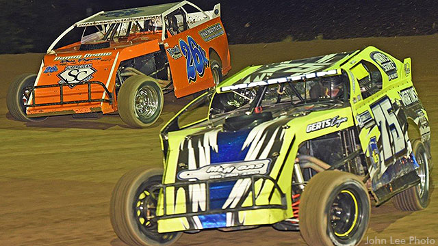 Kevin Blackburn (26) finds his way to the front with a high side pass on Gunner Martin (75) to claim the USRA Modified feature.