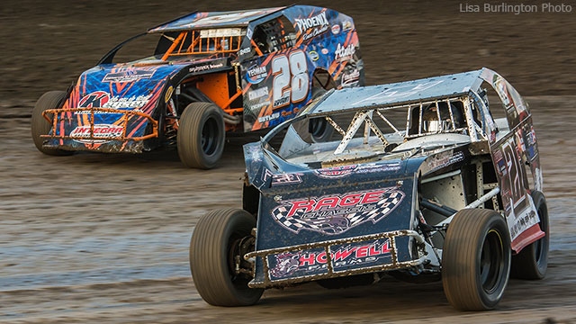 Defending USRA B-Mod national champion Chad Clancy (21) battles with current 2015 USRA B-Mod national points leader Andy Bryant at the Lakeside Speedway.