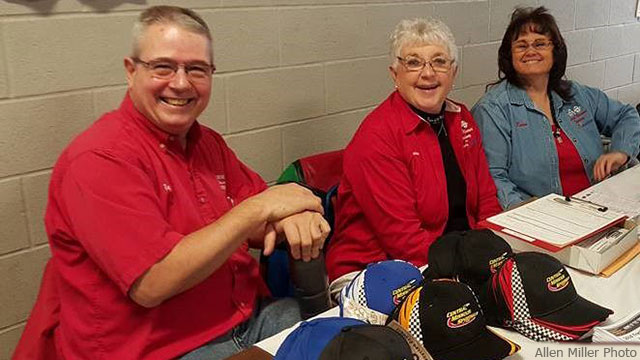 Left to right: Track official Tony Borgstadt, track owner Susan Walls and track official Karen Darling pre-registered drivers at the Bodee's Racers Auction & Trade Show in Sedalia, Mo.