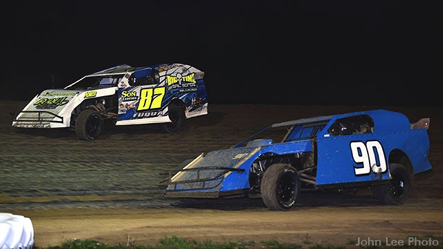 Darron Fuqua (87) and Terry Schultz (90) race during last week's USRA Modified feature at Central Missouri Speedway.