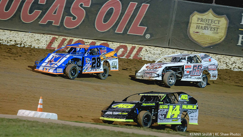 Eventual winner Andy Bryant (28), Shawn Strong (14) and Kris Jackson (56) battle it out in the early stages of Saturday night's Out-Pace USRA B-Mod feature at the Lucas Oil Speedway.