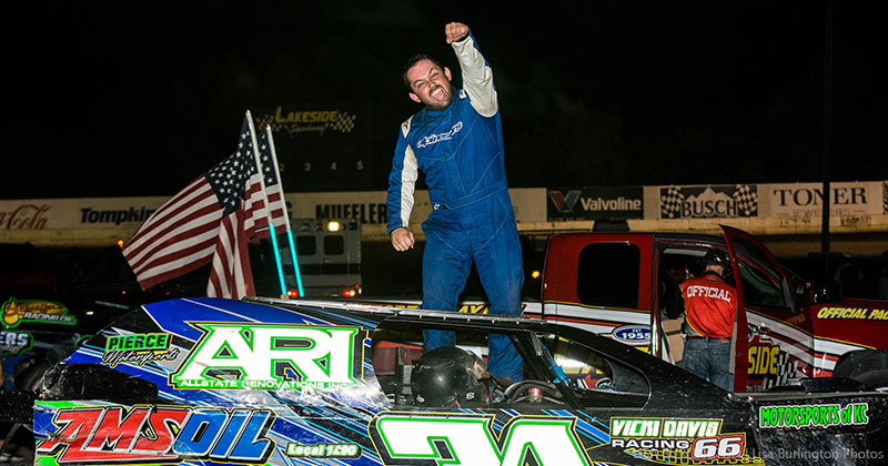 Mark Schafman celebrates after winning the USRA Modified feature on Friday, Aug. 3, at the Lakeside Speedway in Kansas City, Kan.