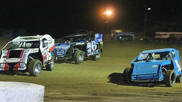 Last week Kerry Davis (16), Jim Moody (6) and Terry Schultz (90) put on a battle for the fans with Moody eventually prevailing and holding off Schultz on the final corner in USRA Modified action to claim his fourth feature win of the year. (Joshua Allee Photo).