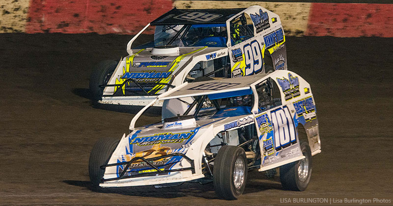Luke Nieman (181) and Brad Smith (99) battle in Out-Pace USRA B-Mod competition lat Friday night at the Lakeside Speedway. (Lisa Burlington Photo)