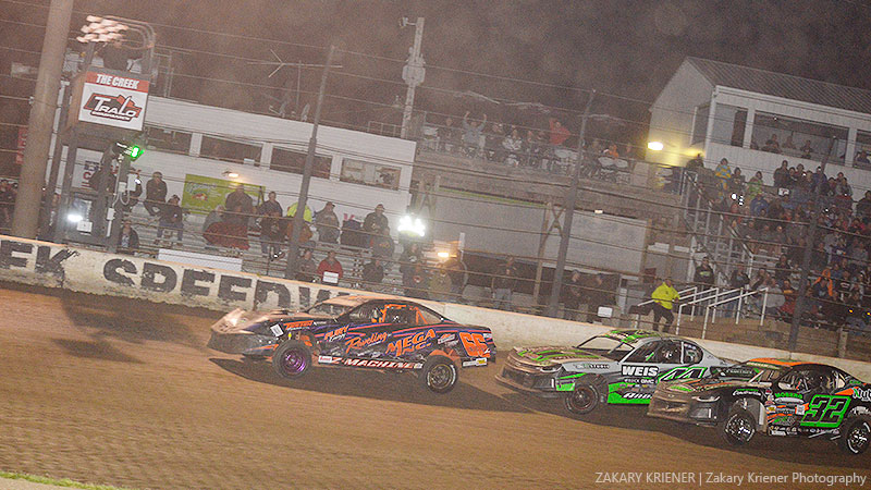 Elijah Zevenbergen took the win by a mere 0.179 second over Dillon Anderson (44) and Derek Green (32) during the Arnold Motor Supply Iron Man Challenge for the American Racer USRA Stock Cars at the Deer Creek Speedway.