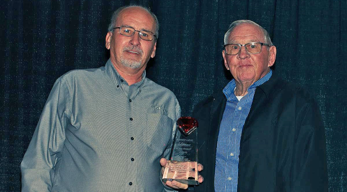 Bill Allen (right) receives the Forrest Lucas Lifetime Achievement Award from Lucas Oil Speedway General Manager Danny Lorton.