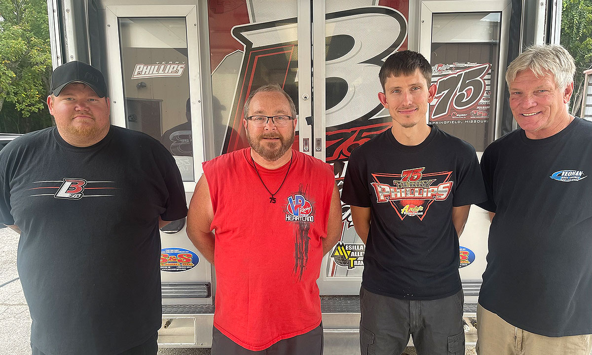 J.C. Morton (second from left) will pilot the B-Mod house car for Bloodline Race Cars owner Terry Phillips (red shirt).