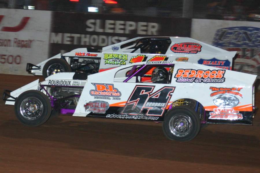 Current points leader David Hendrix (54) looks to hold off Tony Jackson Jr. and Justin Neuman (14) for the Lebanon I-44 Speedway track championship. (Ron Mitchell Photo)