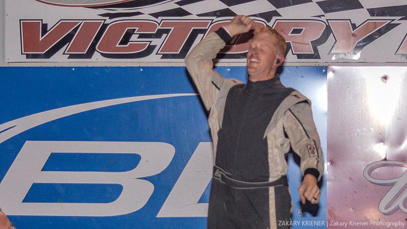 Dillon Anderson celebrates after winning the American Racer USRA Stock Car main event at the Fayette County Speedway in West Union, Iowa, on Friday, June 21, 2019.